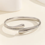 Load image into Gallery viewer, Luxe Wave Crossover Bangle
