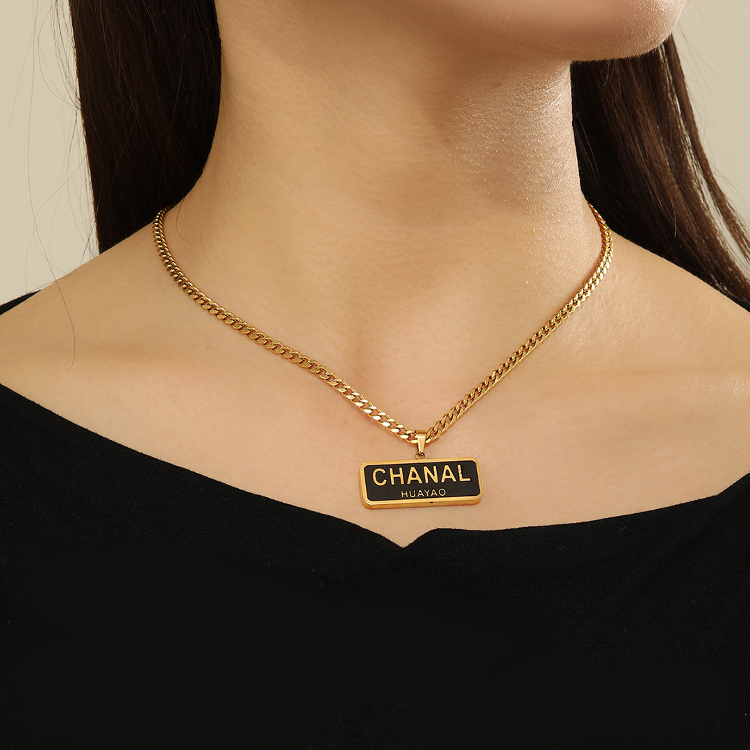 Stunning Chanel Logo Gold Necklace - Reet Pehal