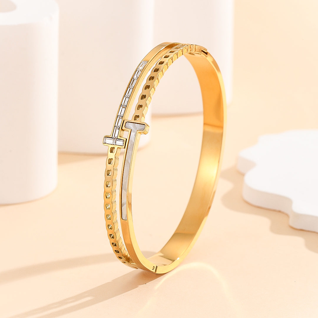 Contemporary Twist Gold Bangle - Reet Pehal