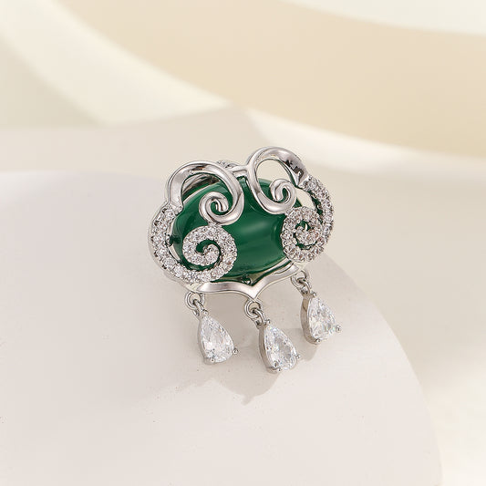 Swirling Emerald Radiance Brooch