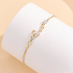 Load image into Gallery viewer, Stylish Stone-Studded Gold Love Bracelet - Reet Pehal
