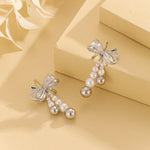 Load image into Gallery viewer, “Pearlescent Silver Bow Earrings - Reet Pehal
