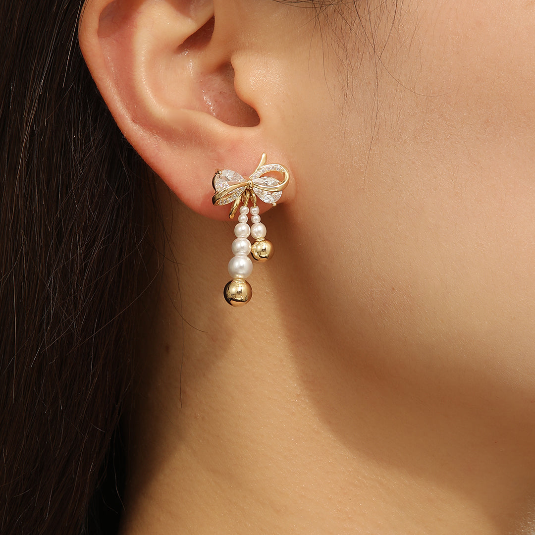 Pearlescent Golden Bow Earrings - Reet Pehal