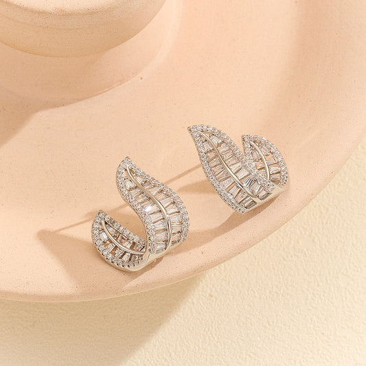 Sparkling Silver Leafy Curved Earrings - Reet Pehal