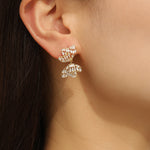 Load image into Gallery viewer, Alluring Golden Bow  Symphony Earrings - Reet Pehal
