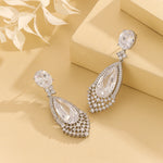 Load image into Gallery viewer, Glistening Silver Halo Pear Earring - Reet Pehal
